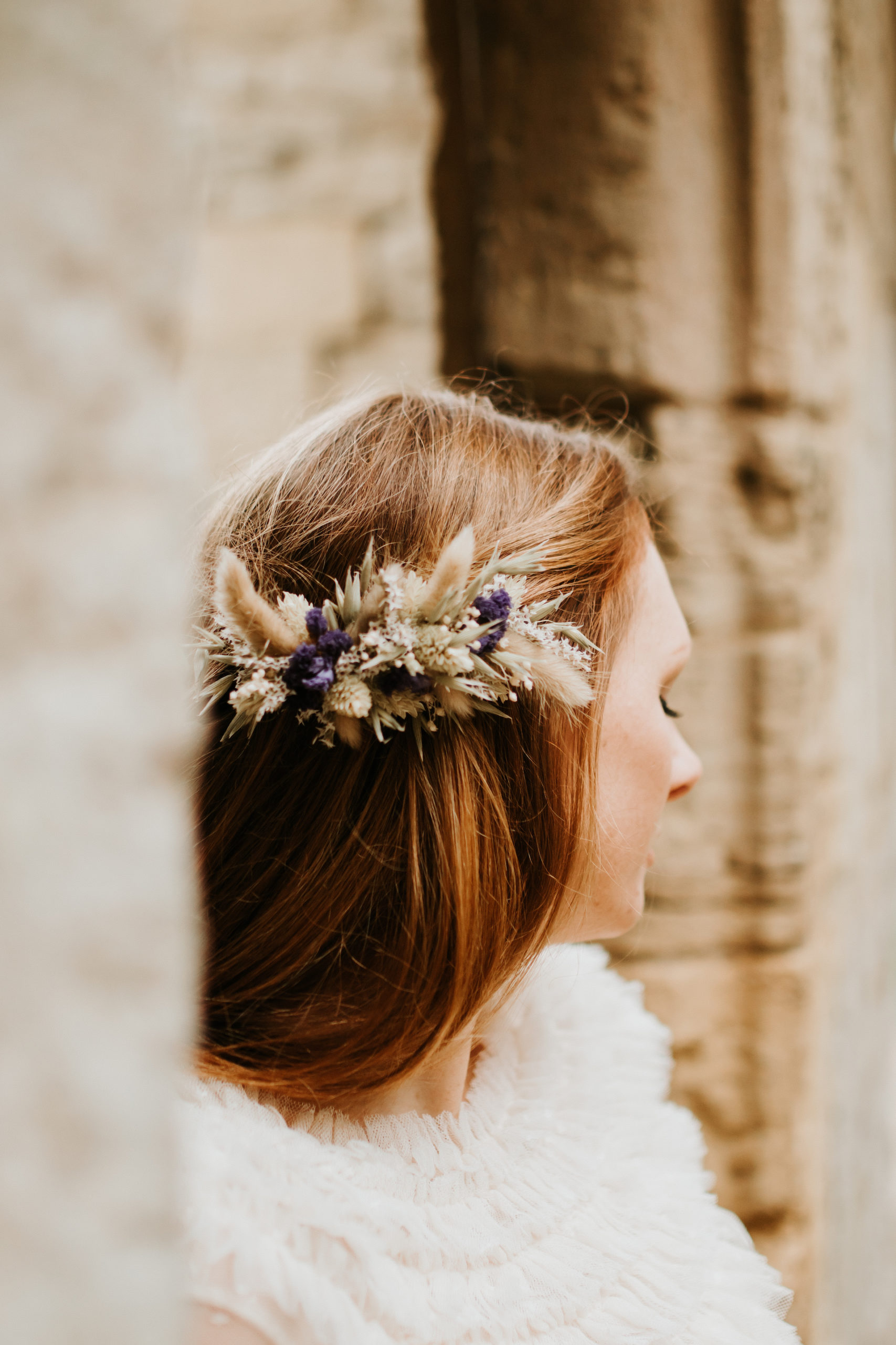 Ginger bride wearing dried flower hair clip