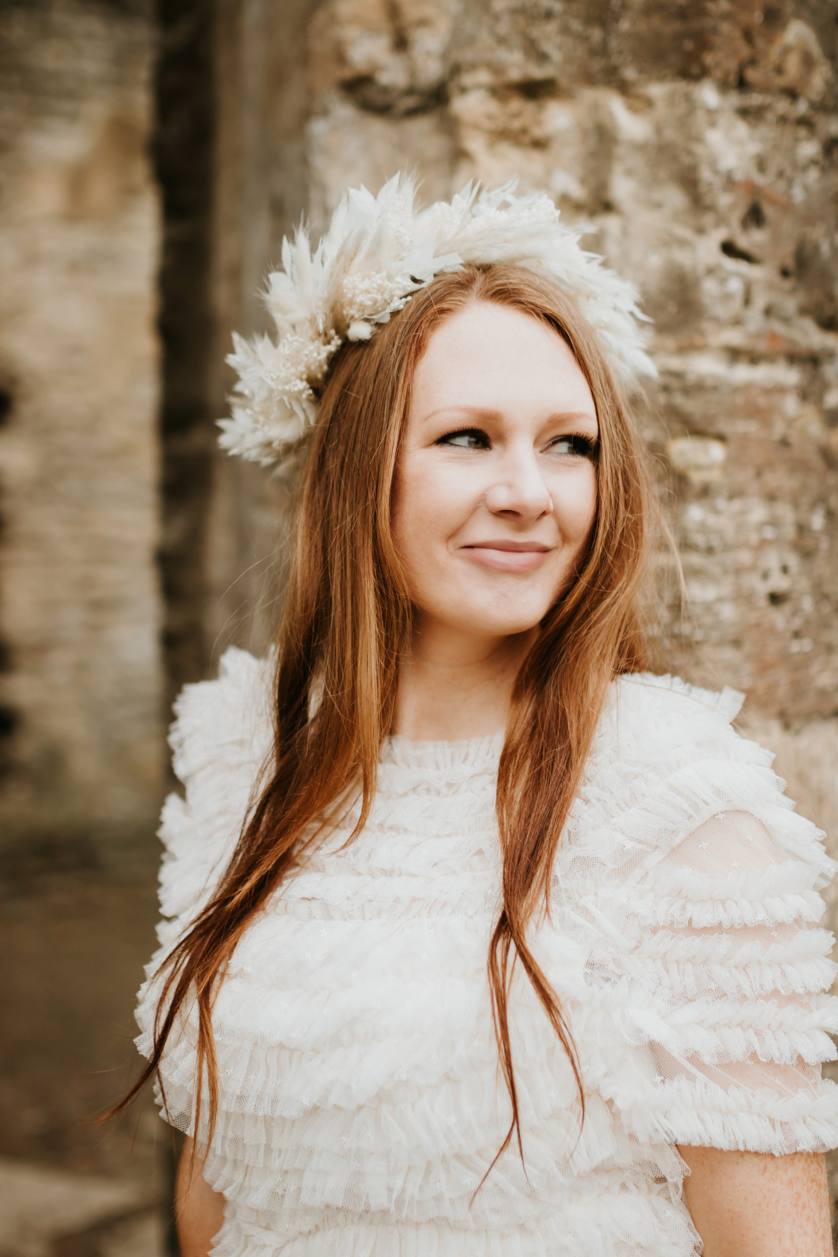 Bridal portrait of ginger bride wearing ruffled wedding dress | Bridal Portraits in The Cotswolds
