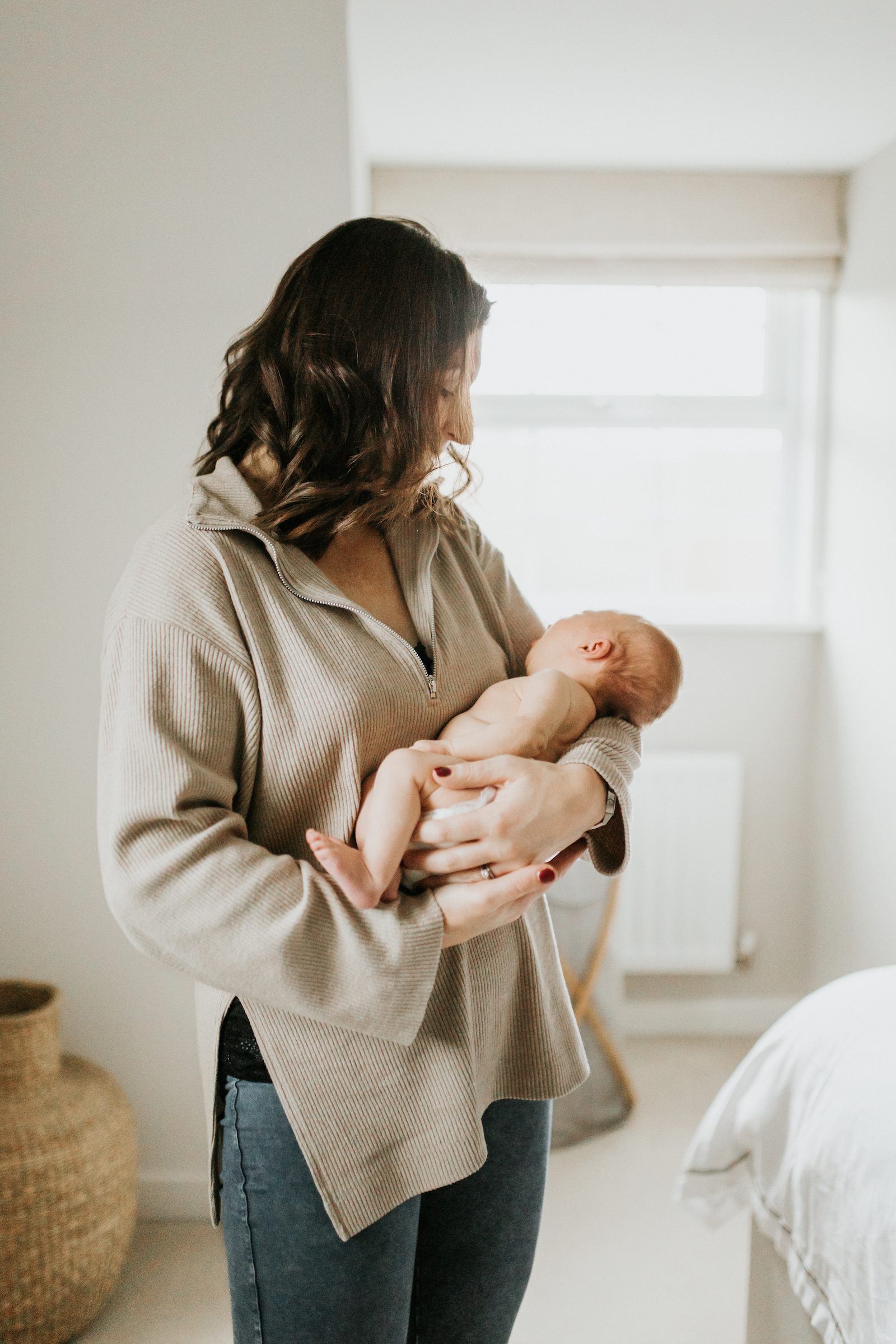 Mum holding newborn baby | beautiful in-home storytelling newborn session