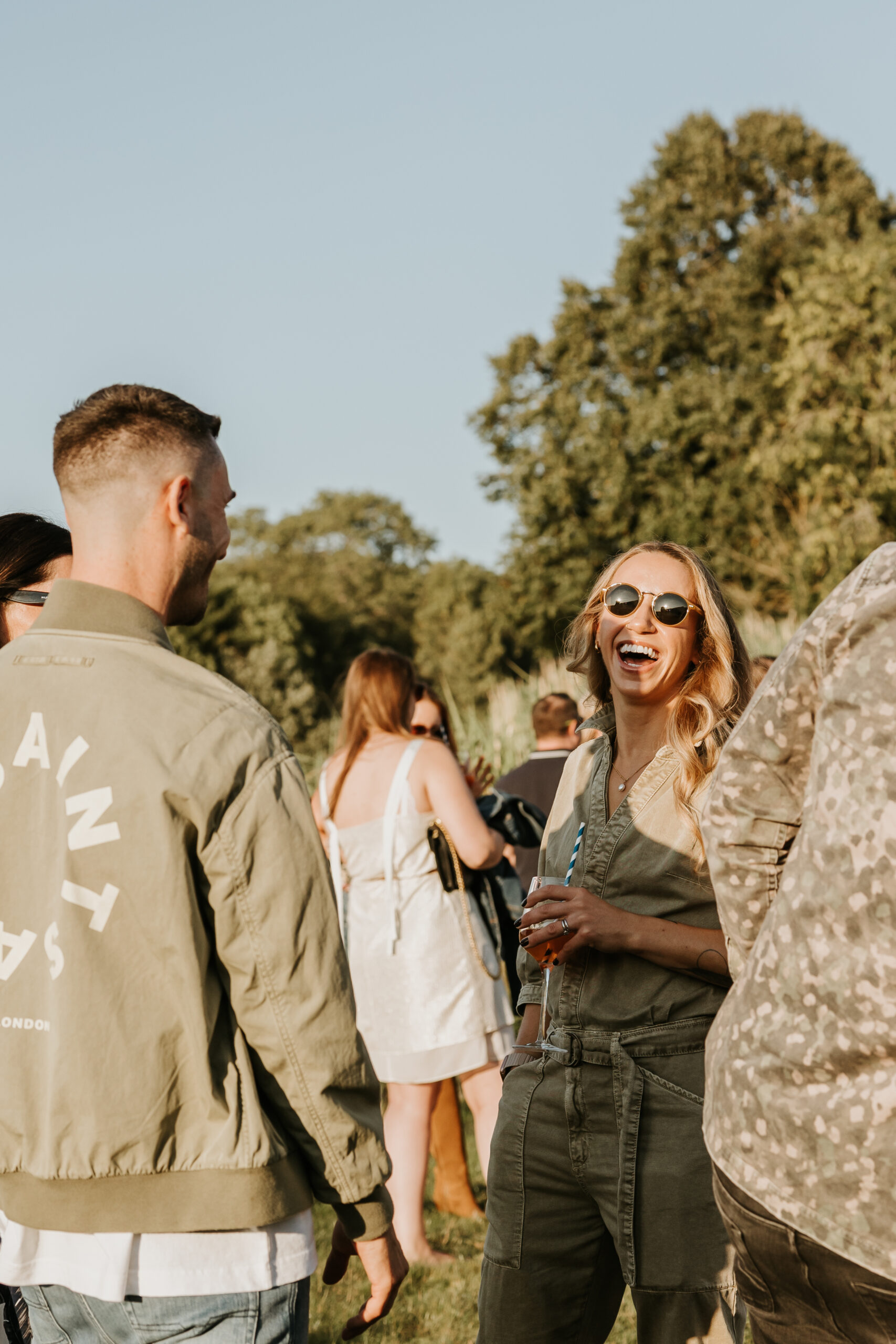 Cotswolds summer event photography, an image of a guest smiling 